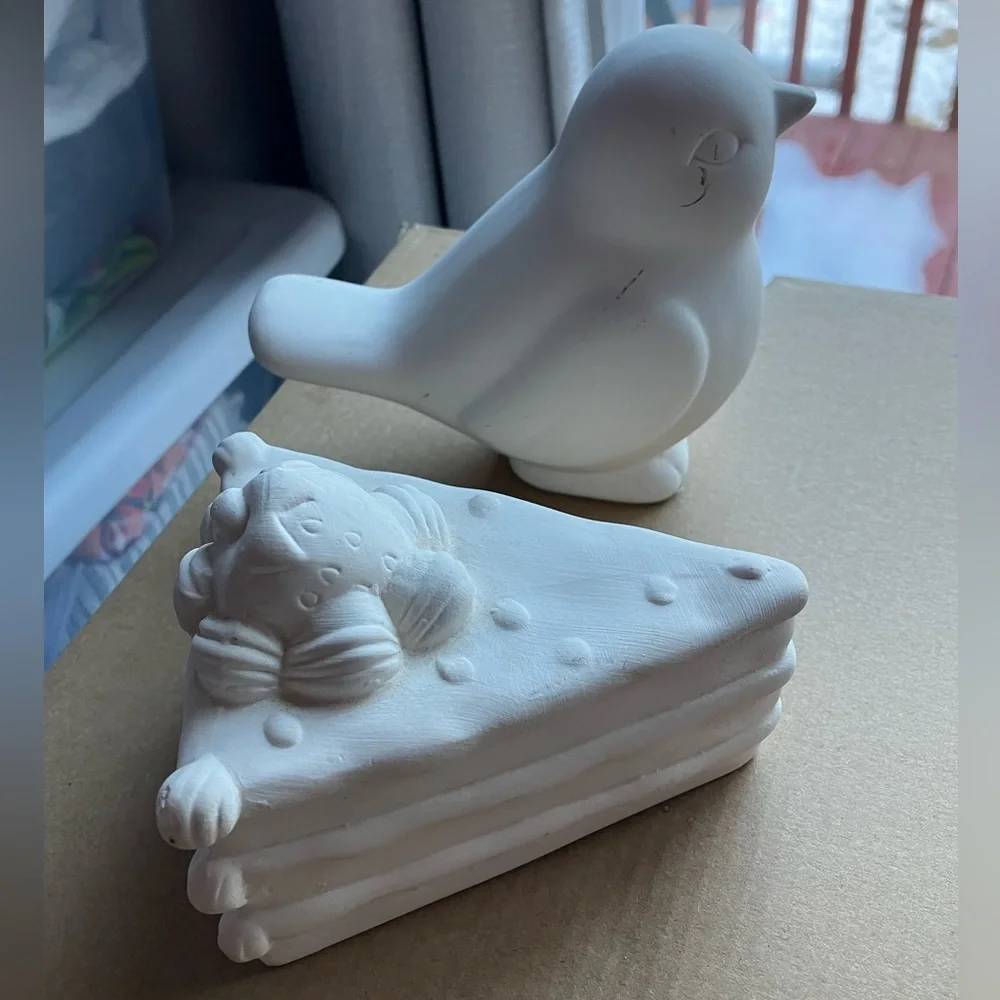 Unpainted bisque ceramic unfinished bird and strawberry cake figurines pottery